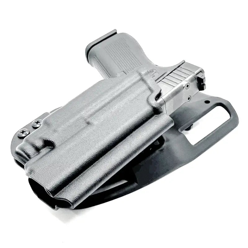 Black Glock 43X pistol in holster with light mounted for first responders