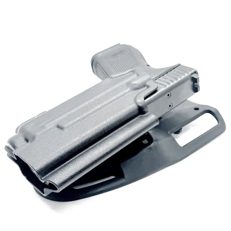 Black Glock 19 in a competition holster with Nightstick TCM-10 and weapon lights