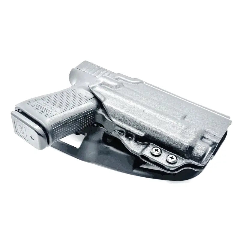 Black Glock 19 in competition holster with Nightstick TCM-10 for weapon lights