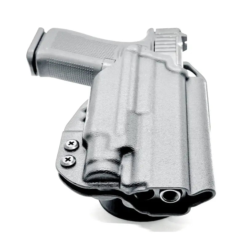 Black Glock 43X pistol with light mounted in a duty holster for first responders