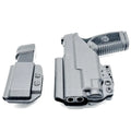 Black pistol with magazine holsters in FN Reflex XL TLR-7 Sub IWB RH Holster combo
