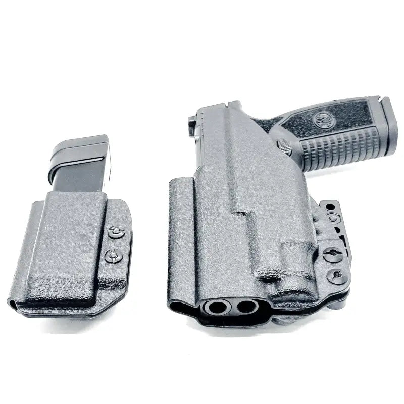 Black pistol with magazine holsters in FN Reflex XL TLR-7 Sub IWB RH Holster combo