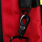 Black plastic clip on red fabric of Firefighter Helmet and Turnout Gear Bag