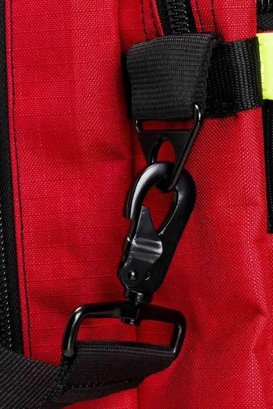 Black plastic clip on red fabric of Firefighter Helmet and Turnout Gear Bag