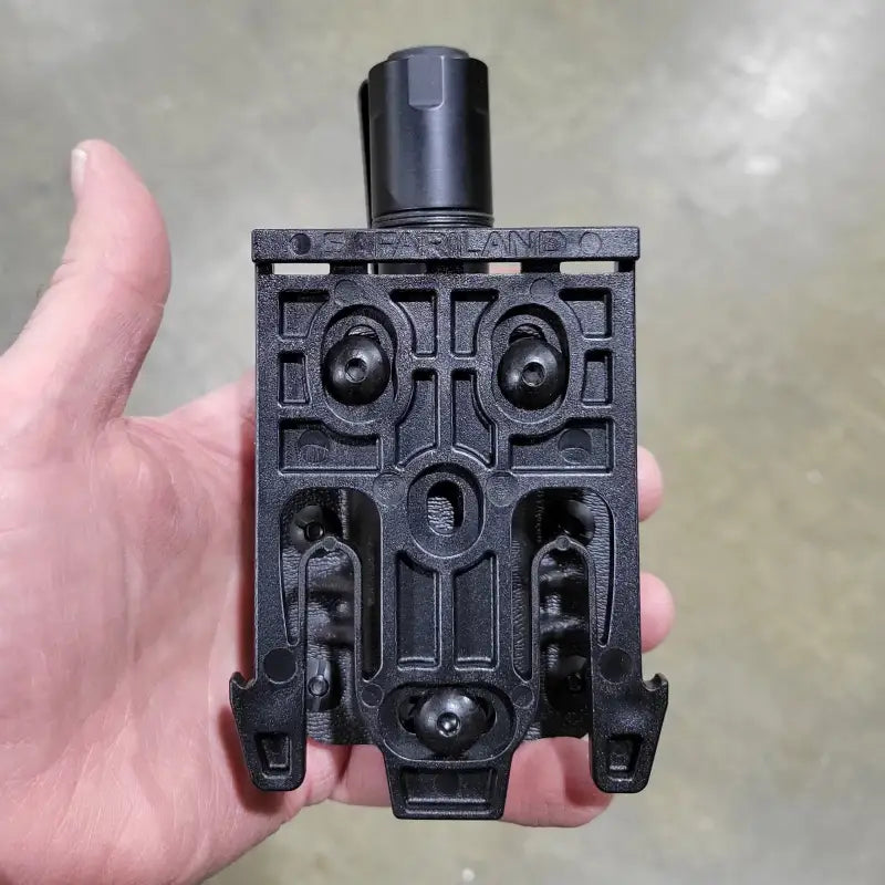 Black plastic holster attachment for Cloud Defensive MCH Duty Flashlight Carrier