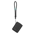 Black portable hard drive with wrist strap next to Olight Baton4KitBK powerful EDC flashlight