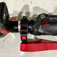 Black and red electric scooter handlebars with controls for Genesis 11C extrication tool carrying