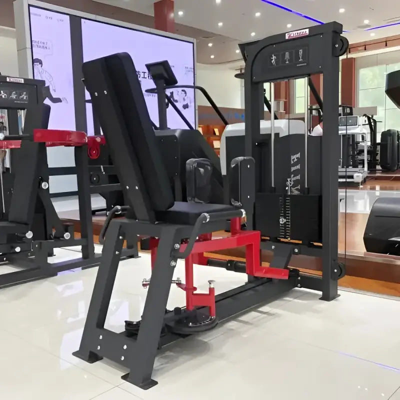 Black and red leg extension machine from SFE Commercial Inner & Outer Thigh Machine for first responders
