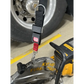 Black and red carrying strap-K12 with spring clips attached to a tire and wheel