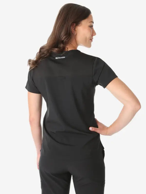 Black short-sleeved Women’s Tuckable One-Pocket Scrub Top viewed from the back