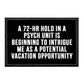 Black patch on velcro loop surface humorously depicts psych unit as a potential vacation opportunity