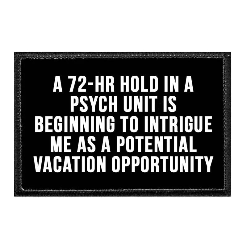 Black patch on velcro loop surface humorously depicts psych unit as a potential vacation opportunity