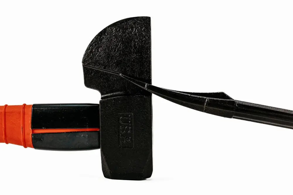 Black sledgehammer with orange rubber grip, featuring a USA patented composite handle