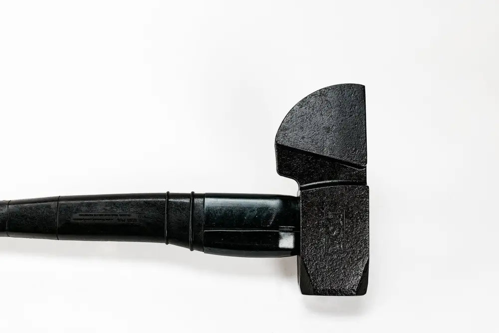 Black sledgehammer with textured striking face and composite handle for effective use