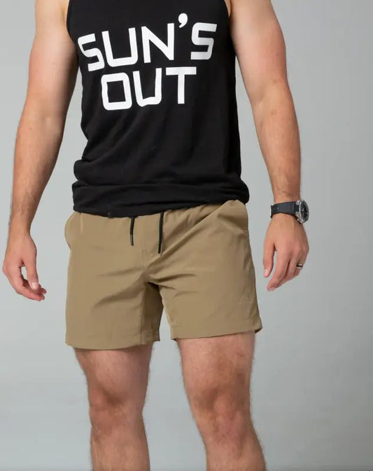 Black sleeveless tank top with SUN’S OUT text and khaki Carrier Training Shorts