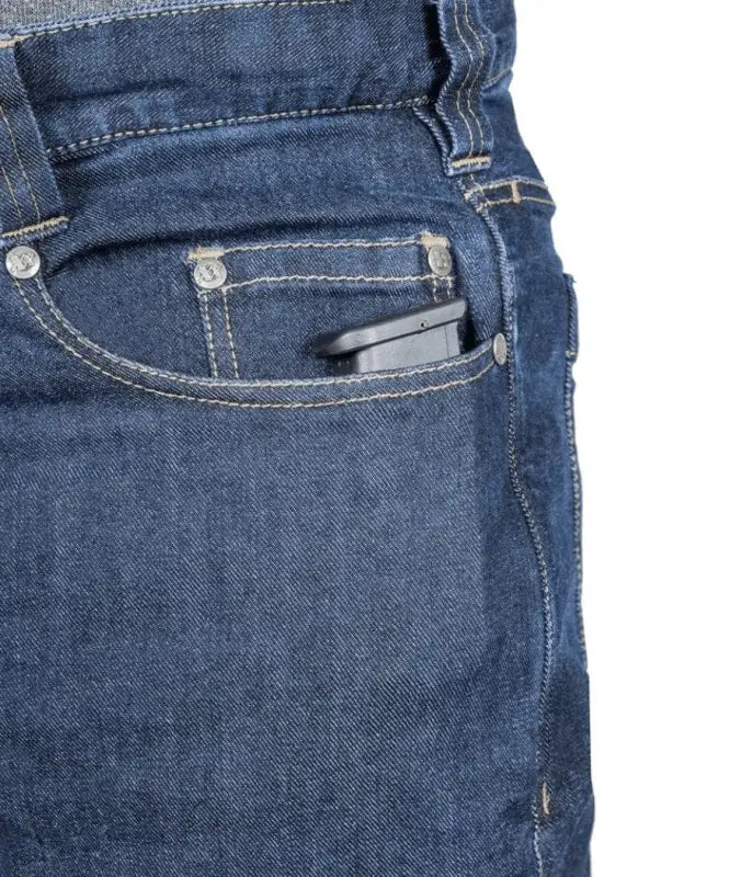 Black smartphone in blue denim pocket of Asset Tactical Jeans for convenient access