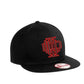 Black snapback baseball cap with red logo design from IDLH Scramble limited edition