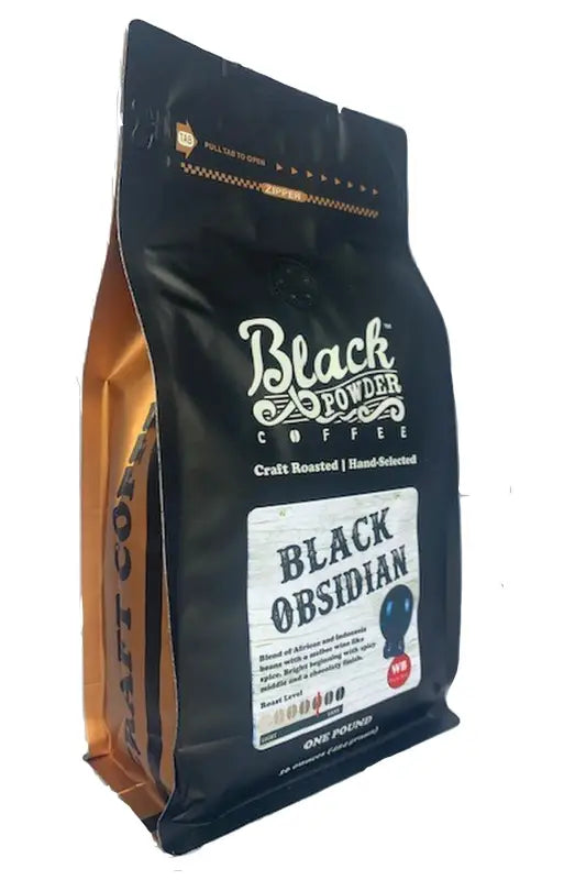 Black Obsidian Coffee Blend in a black stand-up pouch with gold-colored side gussets