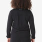 Back view of a women’s long-sleeve scrub top in black for stylish workwear