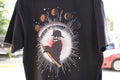 Black T-shirt from Squad 9s Notorious Collection featuring baseball player and moon phases design