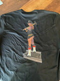 Black level tee featuring a cartoon firefighter on the back from Combat Challenge Firema’am