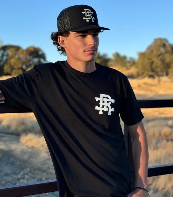 Black Staple Tee with monogram logo and matching cap for first responders, including firefighters