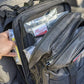 Black tactical backpack for tactical trauma kit and trauma kit storage
