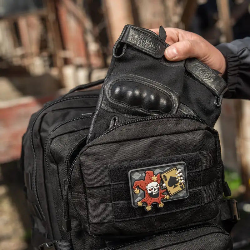 Black M-Tac Assault Pack with skull patch and two large main zippered compartments