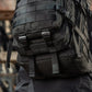 Black M-Tac Assault Pack with MOLLE webbing and large main zippered compartments