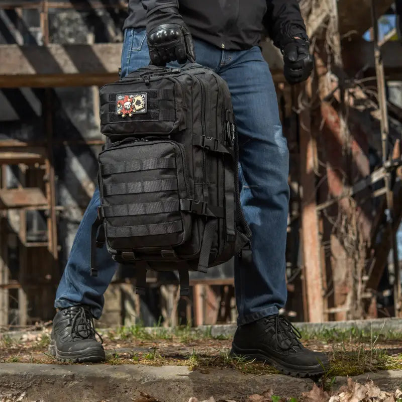 Black M-Tac Assault Pack with large main zippered compartments and MOLLE webbing