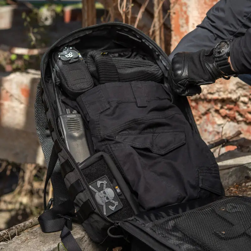 Black tactical M-Tac Assault Pack with large main zippered compartments and multiple pockets