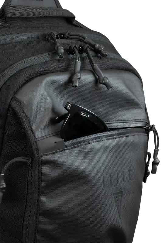 Black tactical backpack with zippered compartments in the BLINDSIDE - Concealed Carry Sling