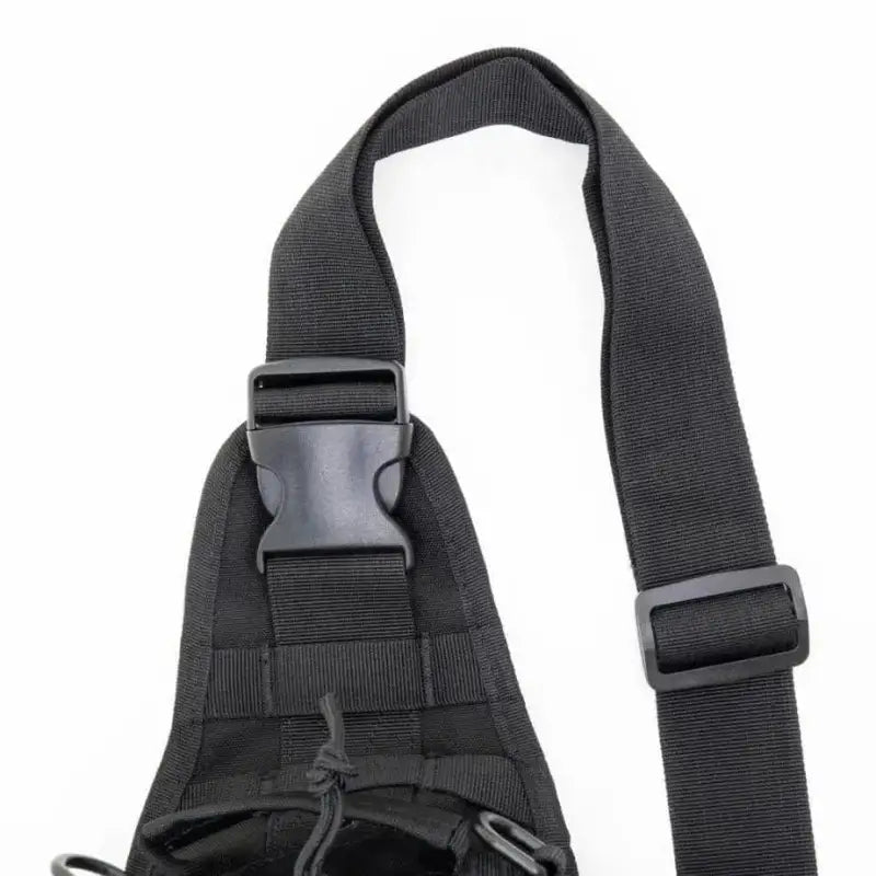 Black tactical shoulder sling backpack with adjustable strap and buckle closure for bleeding control