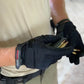 Black tactical glove from Exxtremity Patrol Gloves 2.0 gripping ammunition with hands-free hilight P3X