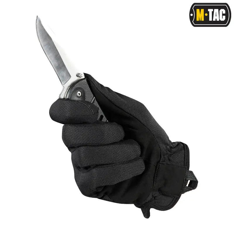 Black M-Tac Gloves Scout Tactical Mk.2 gripping a folding knife, synthetic leather gloves