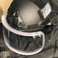 Black tactical helmet with clear ballistic face shield for redemption tactical body armor