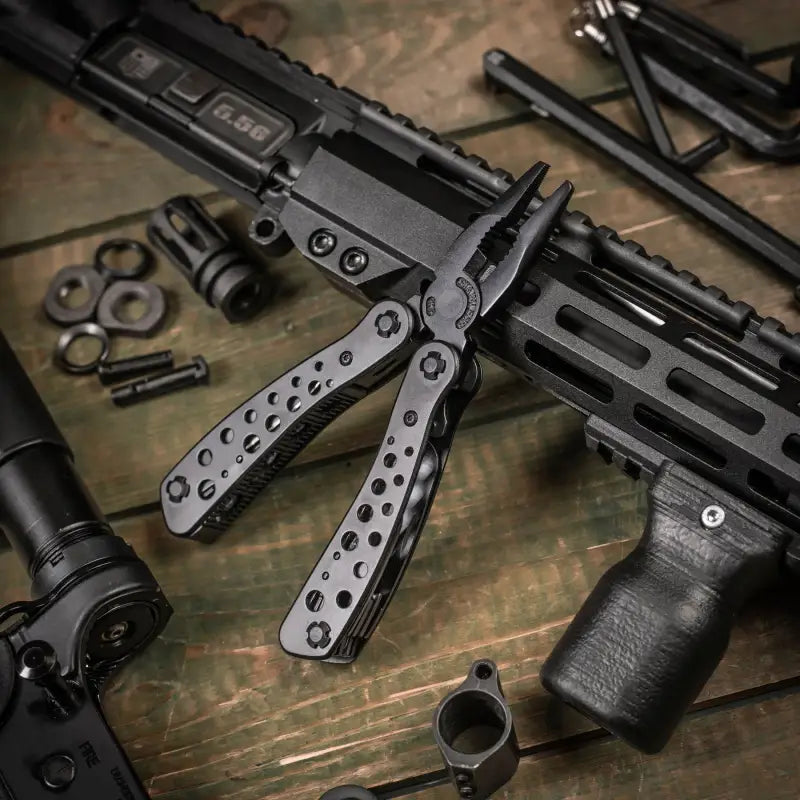 Black tactical rifle with folding bipod attached, featured in M-Tac Multitool Type 1