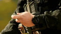 Black tactical wristwatch paired with military gear from B1 Multicam Black Complete Kit