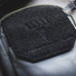 Black textured patch on gray fabric for EDC MOLLE Belt Pocket Organizer for first responders