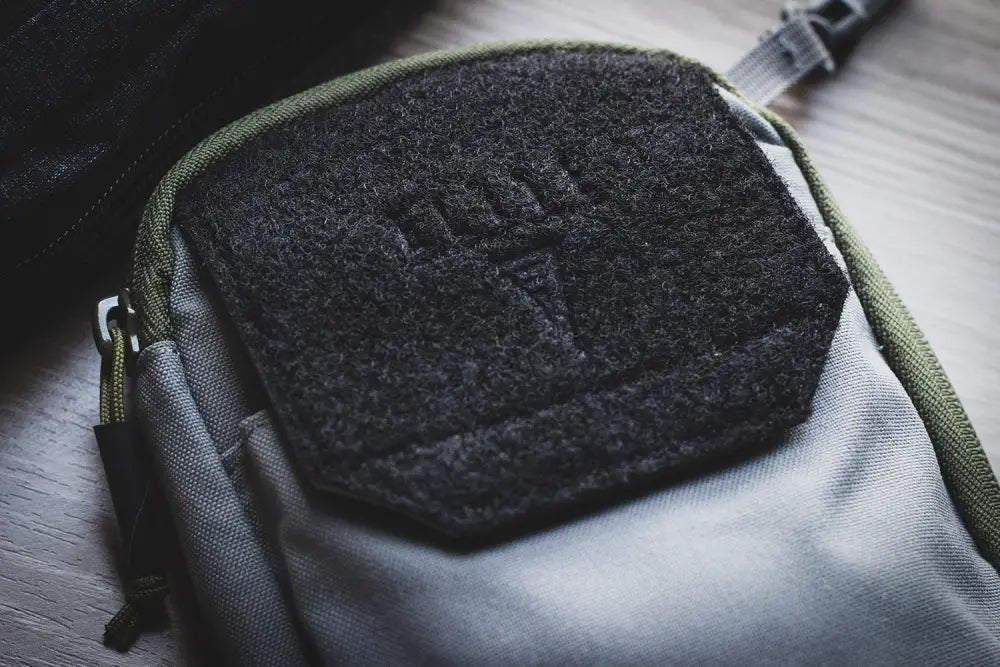 Black textured patch on gray fabric for EDC MOLLE Belt Pocket Organizer for first responders