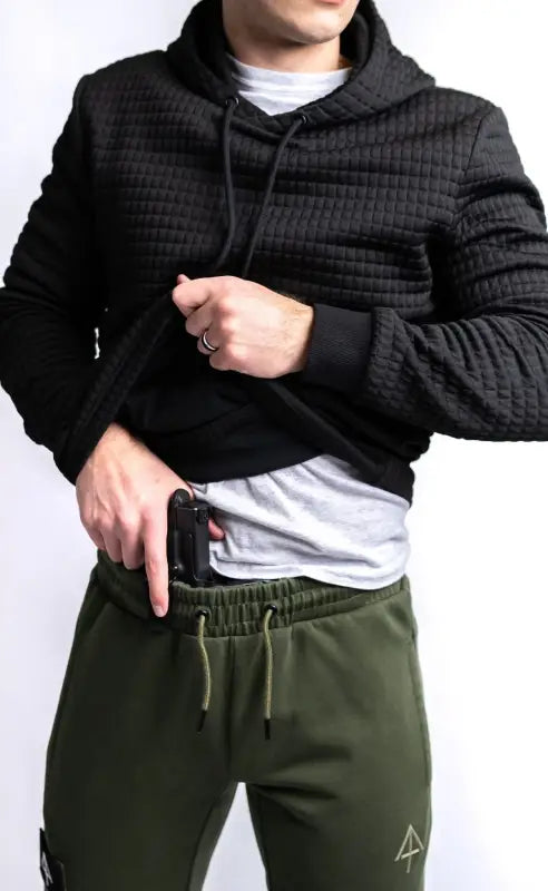 Black textured Standoff Concealment Hoodie Mk.II paired with olive green sweatpants