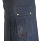 Black utility kilt with cargo pockets and embroidered shield emblem in dark gray