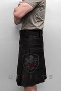 Blackout Utility Kilt featuring a shield emblem with a red star design