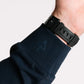 Black watch with rubber strap on Durable Concealment Hoodie showcasing hand pocket and smooth draws