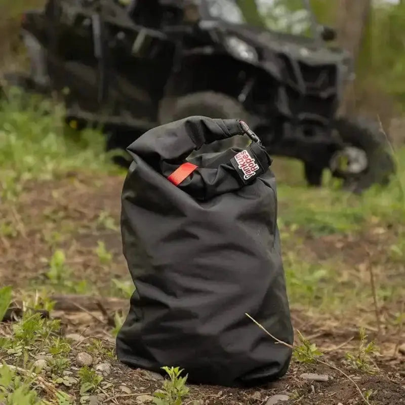 Black waterproof roll-top dry bag with red accent for SXS Off-Road Recovery Kit