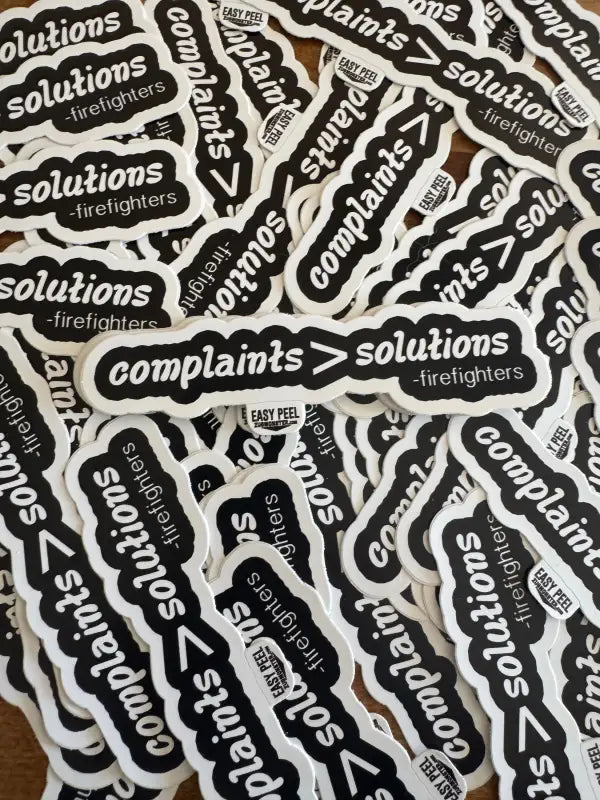 Black and white Complaints> Solutions stickers featuring firefighters and first responders