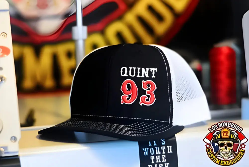 Black and white mesh trucker hat with QUINT 93 for apparatus company - offset first responders