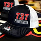 Black and white mesh trucker hat with 737 FIREFIGHTER for first responders from Apparatus Company