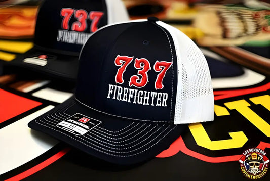 Black and white mesh trucker hat with 737 FIREFIGHTER for first responders from Apparatus Company