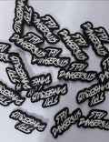 Black and white Stay Dangerous PVC patch for gear and vests, ideal for first responders